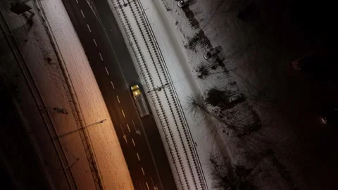 Winter Night View of Road and Railway Tracks from Above Stock Footage 258143149