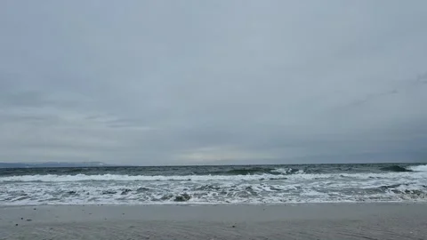 Winter Ocean Waves Leaving Trails of Foam on the Shore Stock Footage 300309164