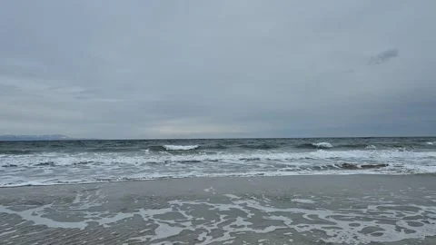 Winter ocean waves reaching the shore Stock Footage 300309026