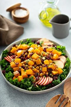 Winter or fall salad with kale and butternut squash Stock Photos