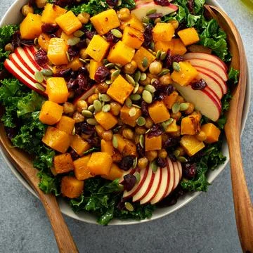 Winter or fall salad with kale and butternut squash Stock Photos