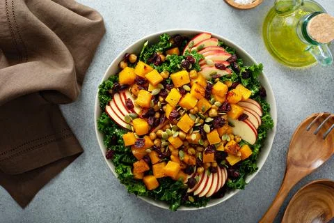 Winter or fall salad with kale and butternut squash Stock Photos