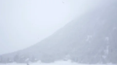 Winter panorama - heavy snowfall in the mountains cinematic slow motion shot Stock Footage 104900230