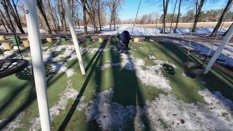 Winter Park Playground with Swing in Motion 库存影片 335188982