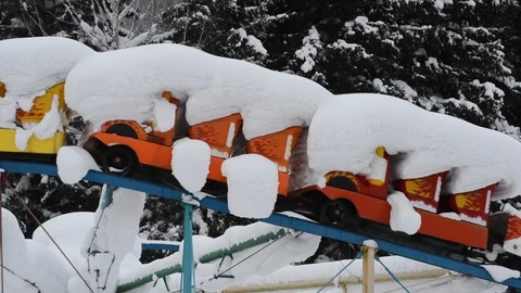 Winter Park with rides under a layer of snow Stock Footage 122905175