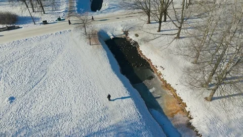 Winter Park In Riga Latvia - Ducks Gather In A Partly Frozen City Canal Stock Footage 346308091