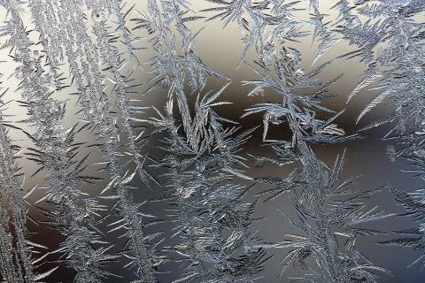Winter pattern of ice crystals on glass Stock Photos