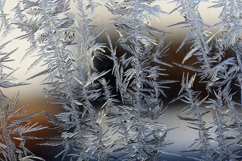 Winter pattern of ice crystals on glass Stock Photos