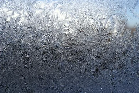 Winter pattern of ice crystals on glass Stock Photos