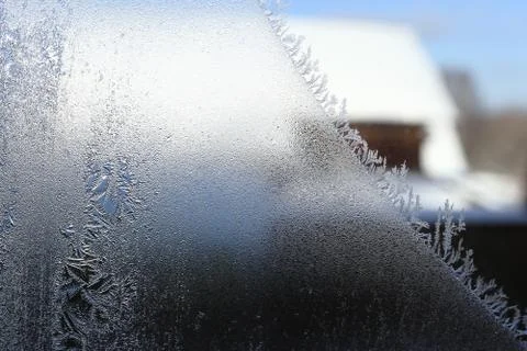 Winter pattern of ice crystals on glass Stock Photos