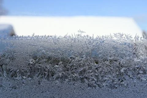 Winter pattern of ice crystals on glass Stock Photos