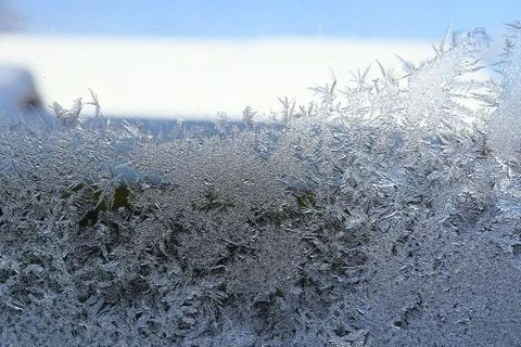 Winter pattern of ice crystals on glass Stock Photos