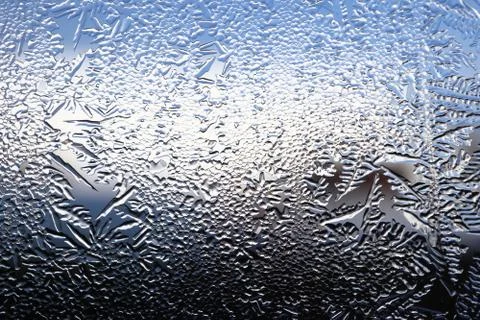 Winter pattern of ice crystals on glass Stock Photos