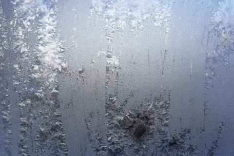 Winter pattern of ice crystals on glass Stock Photos