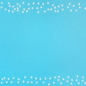 Winter pattern made of small white snowflakes Stock Photos