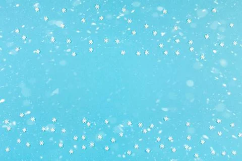 Winter pattern made of small white snowflakes Stock Photos