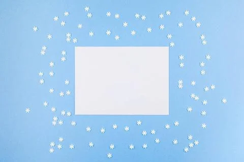 Winter pattern made of small white snowflakes Creative Top view flat lay w... Stock Photos