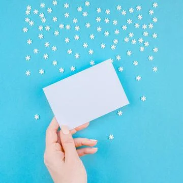 Winter pattern made of small white snowflakes Creative Top view flat lay w... Stock Photos