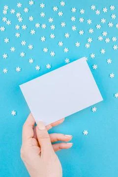 Winter pattern made of small white snowflakes Creative Top view flat lay w... Stock Photos
