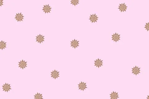 Winter pattern made of snowflakes and on pink background. Stock Illustration
