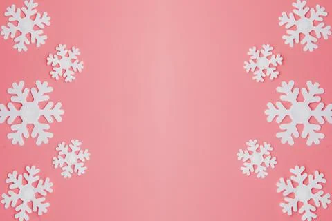 Winter pattern made of snowflakes and on pink background. Christmas concept.  Stock Photos