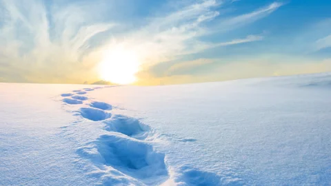 Winter plain covered by a snow at the sunset with human track Stock-Footage 254724860