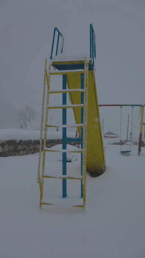 Winter playground covered in snow Video stock 327687713