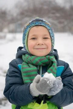 Winter portrait of kid boy in colorful clothes Stock Photos