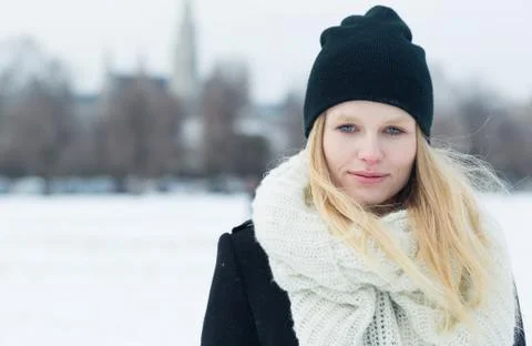 Winter portrait of young beautiful blonde woman outdoors. Stock Photos