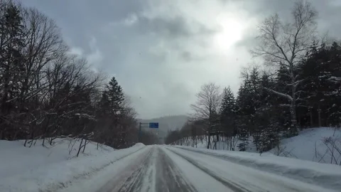 Winter POV Drive on Route 237 Passing Asahikawa Biei Road Sign in Furano 動画素材 333696977