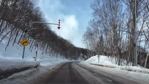 Winter POV Drive Through Snow Forest in Furano Hokkaido Japan Stock Footage 333586735