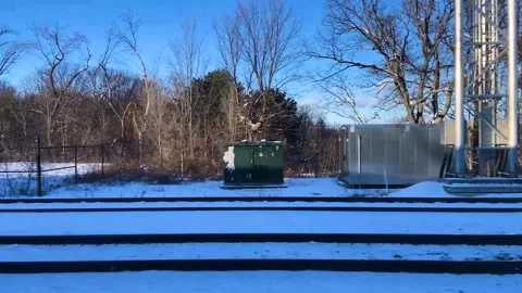 Winter POV from a moving train crossing a wide open forest area covered in Stock Footage 331429477