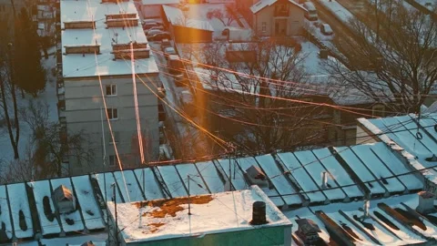 Winter Power Lines In Riga Latvia - Golden Sunset Over Snowy Urban Homes Stock Footage 345474039