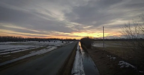 Winter Prairie Road at Sunset Stock Footage 84973953