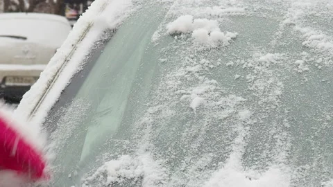 Winter problems of car drivers. Machine, covered with snow Stock Footage 146111456