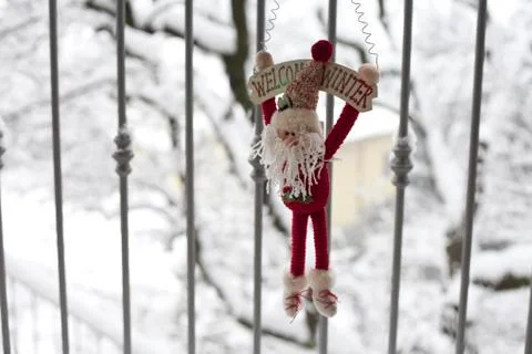 Winter puppet on a snowy background Stock Photos