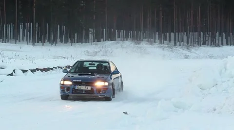 Winter racing car passing by DNxHD Stock Footage 10737133
