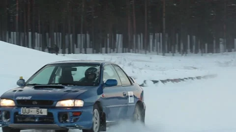 Winter racing car passing by ProRes Stock Footage 10720274