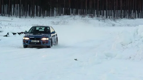 Winter rally car going by DNxHD Stock Footage 10737134