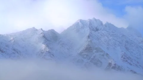 Winter The Remarkables Ski Resort snow covered peaks birds flying morning cloud 動画素材 334777944