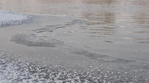 Winter river and snow. Cold water flows through the river ice. Siberia, Russia. Stock Footage 82643393