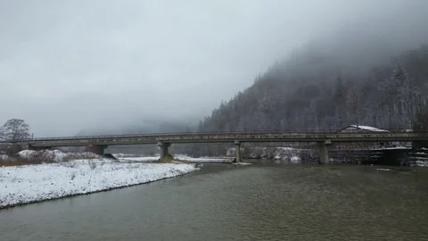 Winter River with a Bridge Covered in Snow Vidéo 300508297