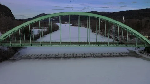 Winter river bridge fly-through drone Stock Footage