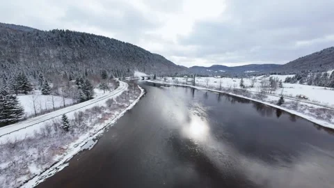 Winter River Flow in Mountain Valley Stock Footage 321624238