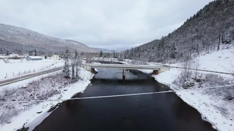 Winter River Flow in Mountain Valley Stock Footage 321624288