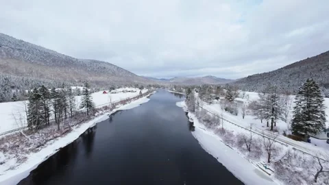 Winter River Flow in Mountain Valley Stock Footage 321624329
