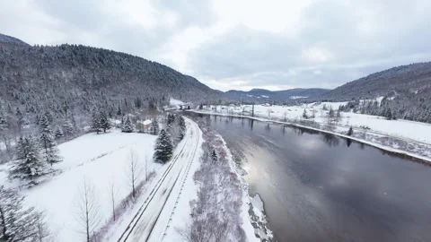 Winter River Flow in Mountain Valley Stock Footage 321624344
