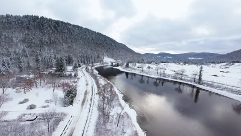Winter River Flow in Mountain Valley Stock Footage 321624353