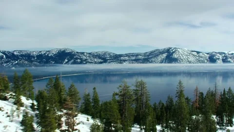 Winter river flowing through snow covered forest Stock Footage 340963342