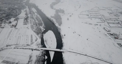 Winter river flying drone snowflakes whirling snowfall ferry 動画素材 122601366